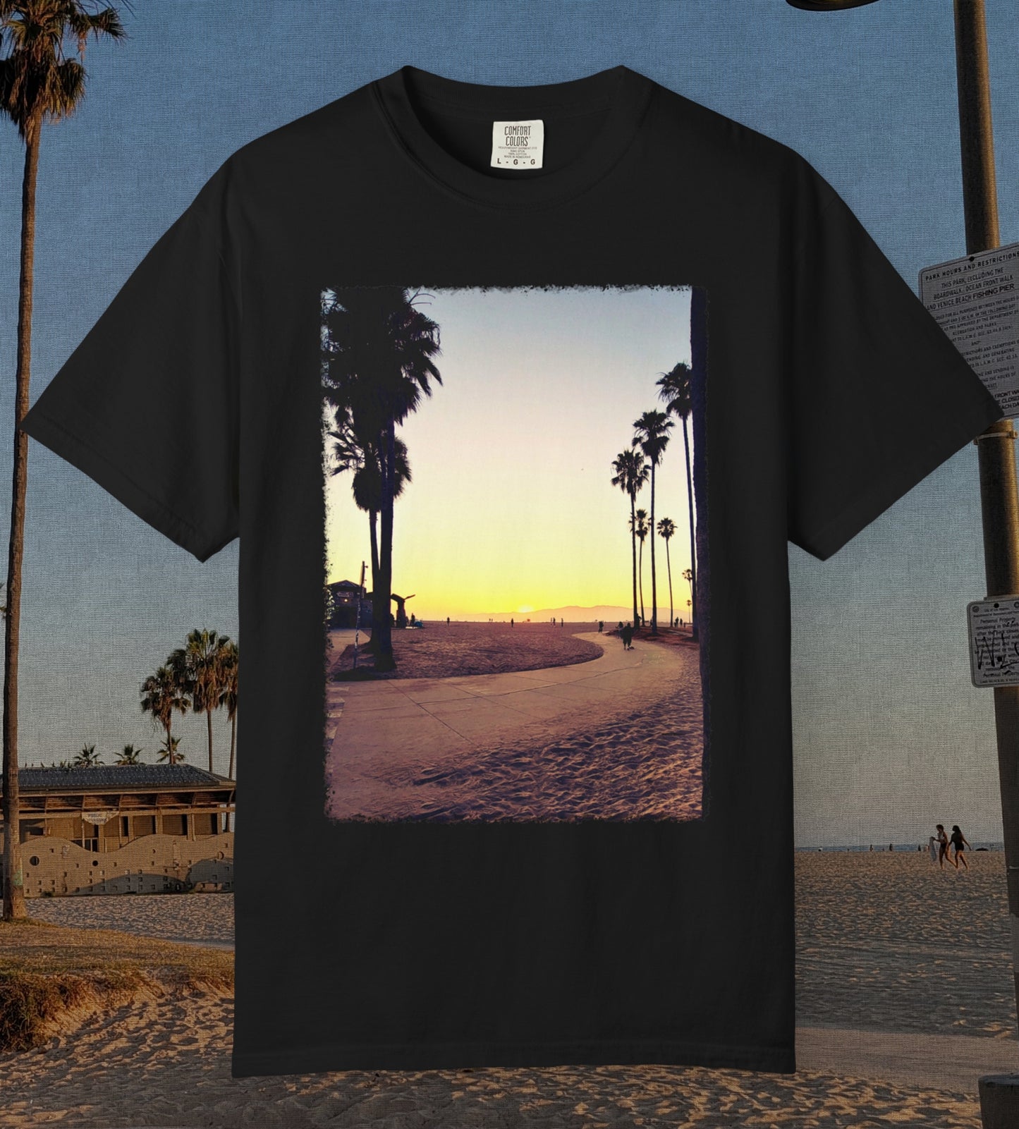Comfort Colors 100% cotton black t-shirt featuring a durable dtf transfer of Venice Beach at Sunset with palm tress and the boardwalk.