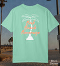 Comfort Colors cotton t-shirt Island reef green in color featuring durable DTF back design of a white palm tree and the words Book Beach Beverage in orange.
