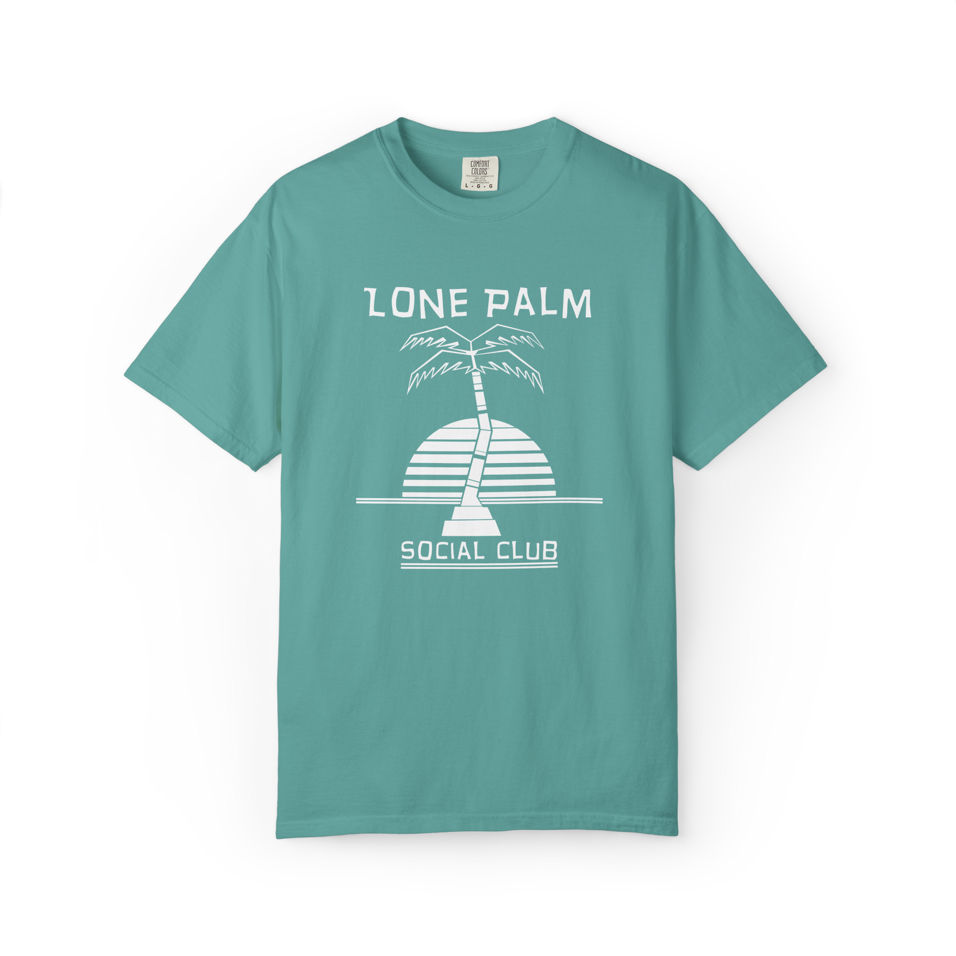 Sea foam green teal Comfort Colors graphic t-shirt with DTF  'Lone Palm Social Club' palm tree graphic on a white background.