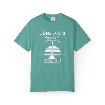 Sea foam green teal Comfort Colors graphic t-shirt with DTF  'Lone Palm Social Club' palm tree graphic on a white background.