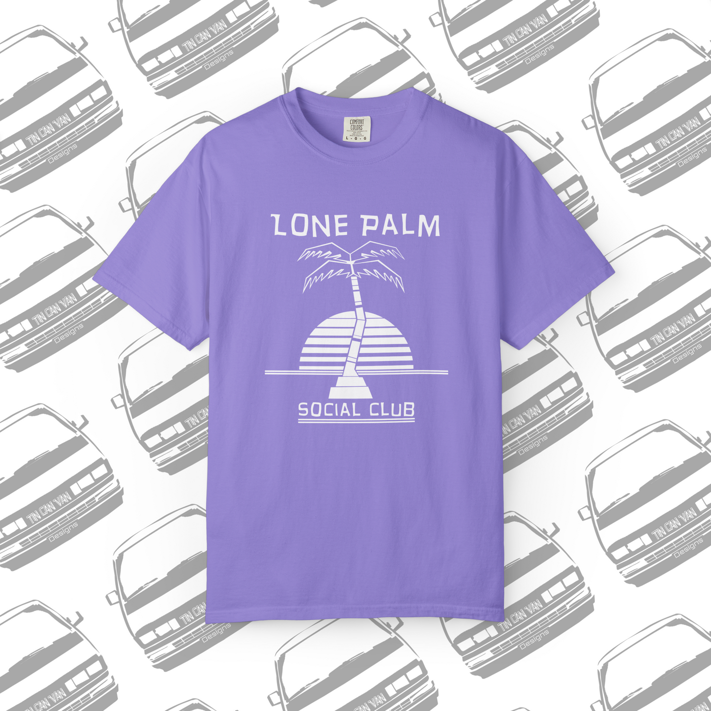 Violet purple Comfort Colors graphic t-shirt with DTF  'Lone Palm Social Club' palm tree graphic on a background with van silhouettes.