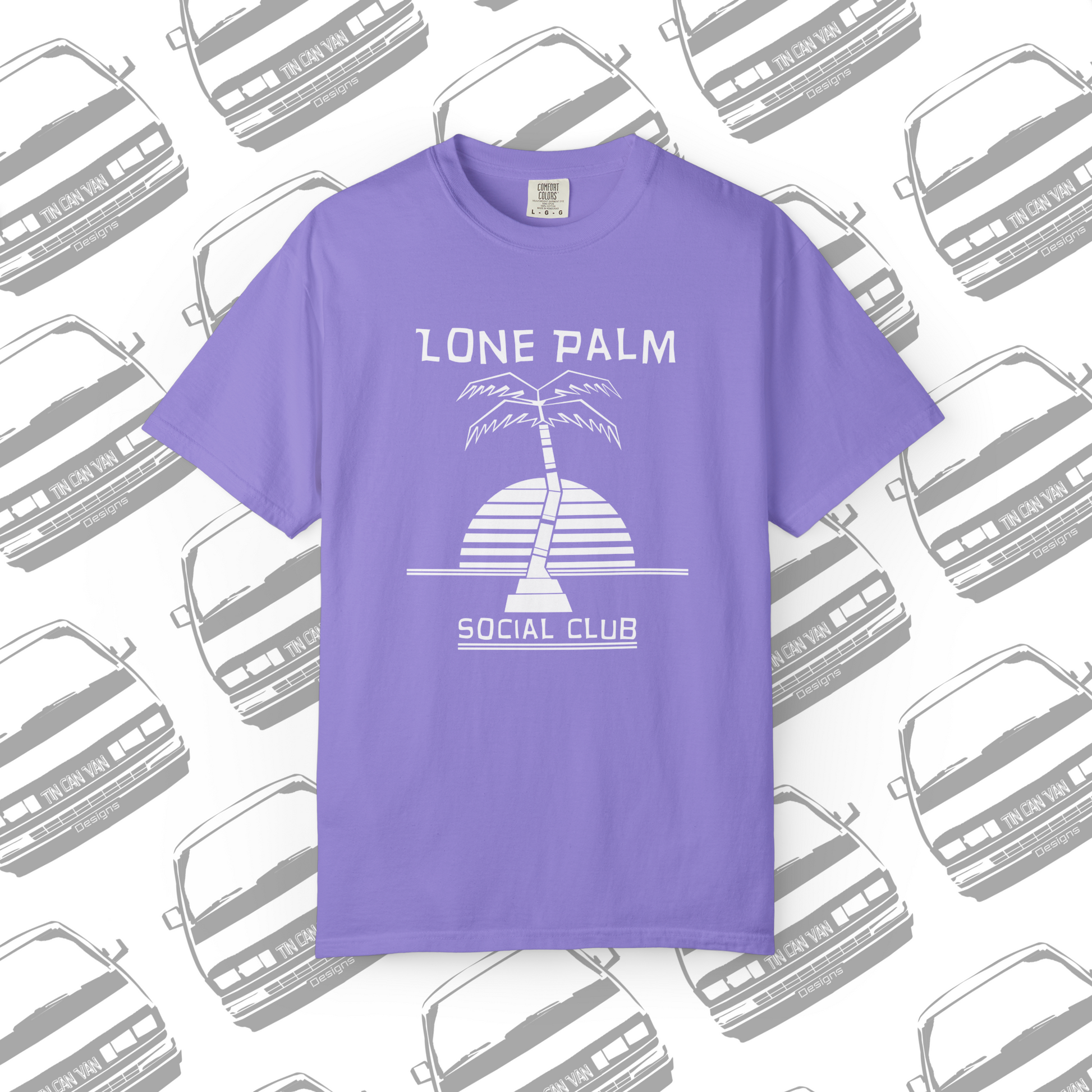 Violet purple Comfort Colors graphic t-shirt with DTF  'Lone Palm Social Club' palm tree graphic on a background with van silhouettes.